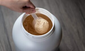 measuring scoop of whey protein powder