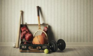 old suitcase with sports equipment