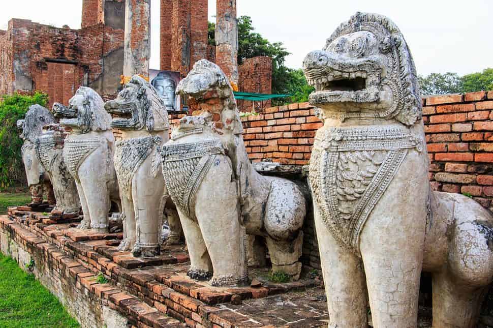 Antique Stupa surrounded by Lion statue cambodia style in Thammikarat Temple in Ayutthaya Thailand
