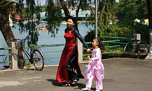 Mother and daughter walking in the park in Ho Chi Minh City Vietnam