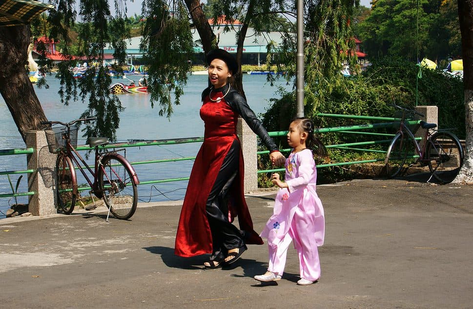 Mother and daughter walking in the park in Ho Chi Minh City Vietnam