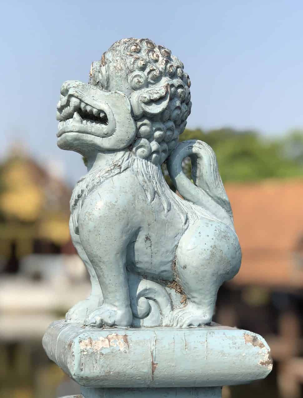 Wooden lion statue at the floating market