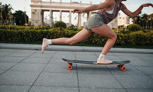 woman on skate longboard