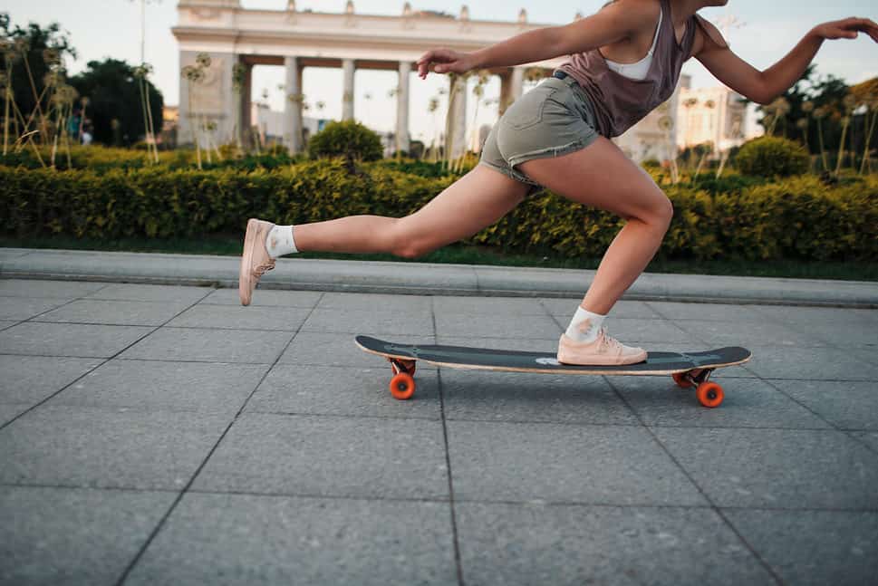 woman on skate longboard